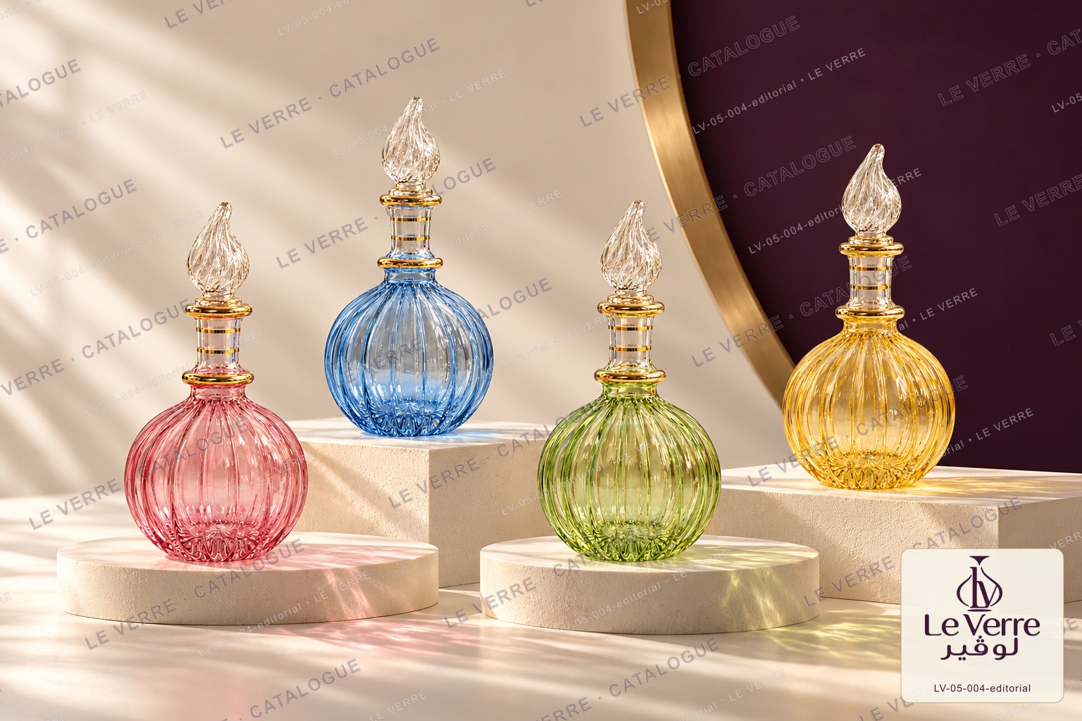 Le Verre catalogue image: a coordinated set of four round ribbed glass bottles in pink, blue, green and amber with flame-shaped stoppers, with the Le Verre catalogue logo