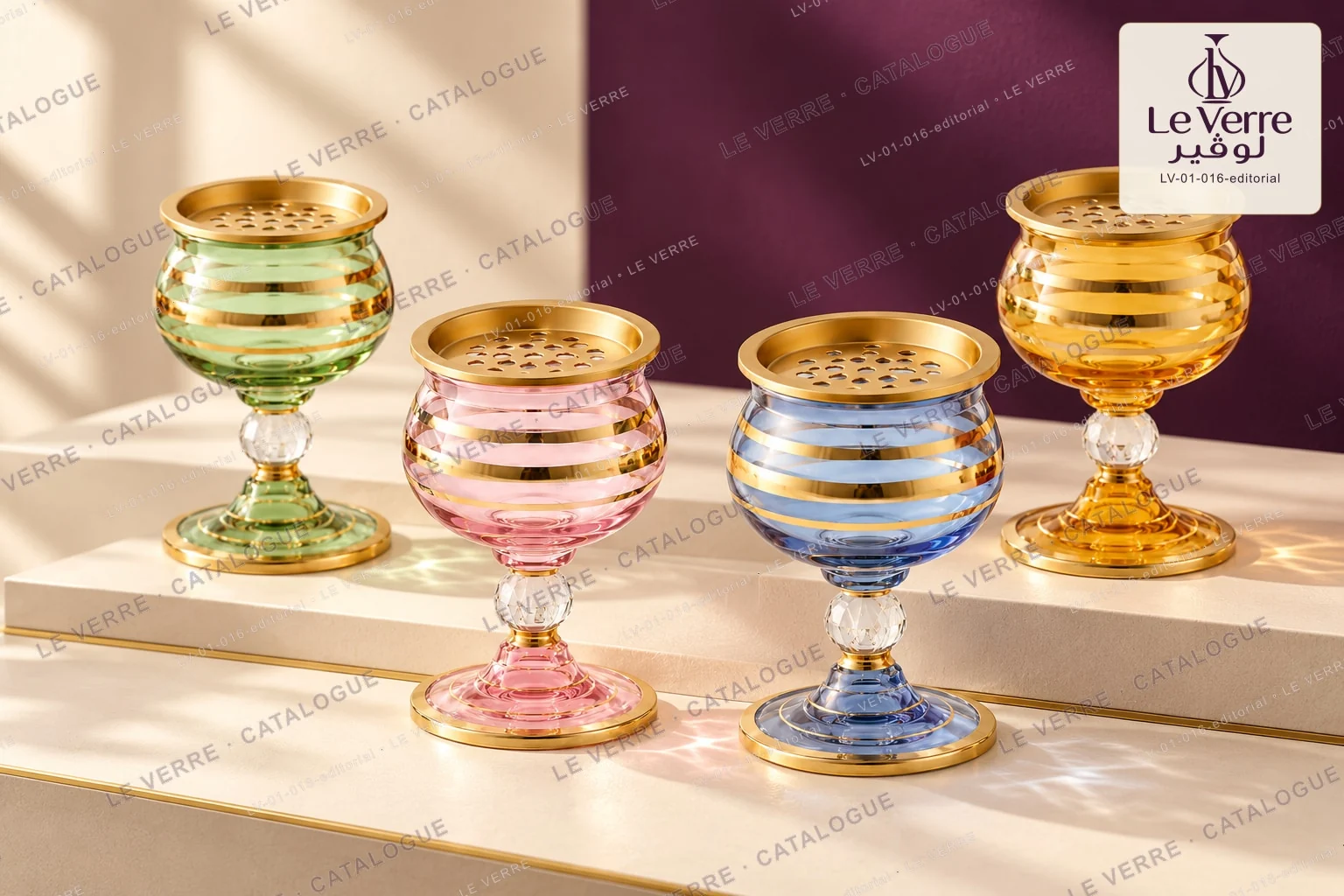 Four decorative glass incense vessels on pedestal bases in green, pink, blue and amber with gold-tone bands, shown in a studio setting