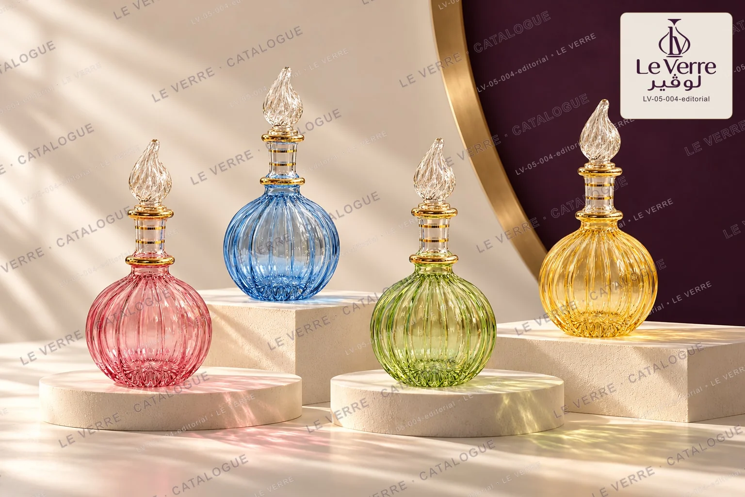 Four large round ribbed decorative glass bottles in pink, blue, green and amber with clear flame-shaped stoppers on studio plinths